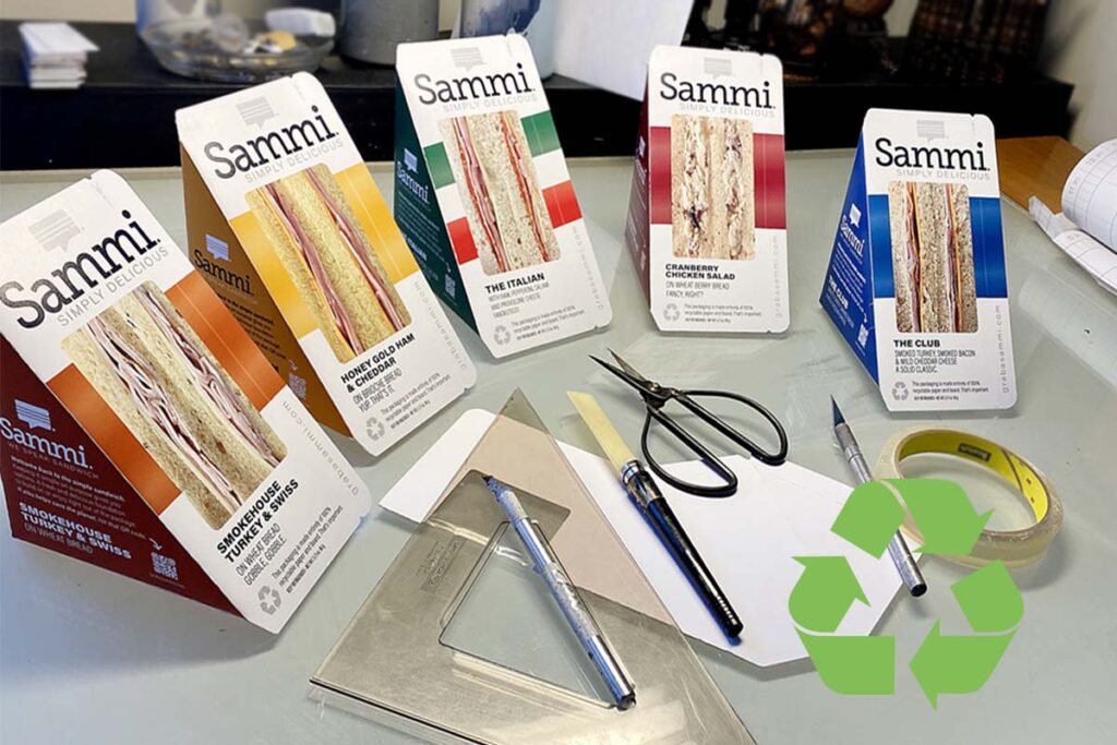 Image of Sammi sandwiches preproduction sustainable packaging design with recycle logo superimposed